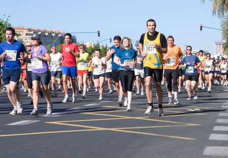 VALENCIA, SPAIN - JUNE 20: Runners compete in the XII 6km Carrera Popular Tendetes run on June 20, 2010 in Valencia, Spain. のeditorial素材