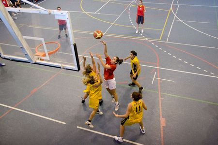 VALENCIA, SPAIN - NOVEMBER 14:  Womens basketball teams, National & Technical University of Athens (yellow) plays the University of Crete (red) in the EuroValencia games on November 14, 2010 in Valencia, Spain.のeditorial素材