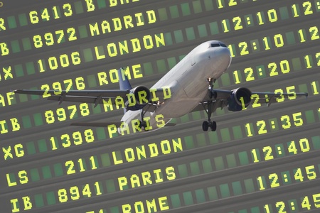 Flight Board and Airliner Landing at the Airport