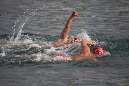 VALENCIA, SPAIN - JULY 22: Unknown athletes compete in the 20th Annual 2,000 meter Valencia Port Swim in the Port of Valencia on July 22, 2012 in Valencia, Spain.のeditorial素材