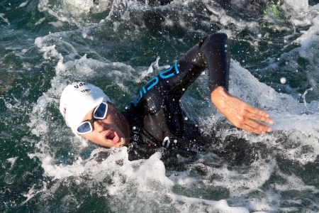 Valencia, Spain. 2nd June 2013. An unknown triathlete competes in the swim leg of the II Triathlon LD Valencia.  The triathlon is a 1,900 meter swim, 90 km bike and a 21 km run.  The swim portion took place inside the harbor of the port of Valencia.のeditorial素材