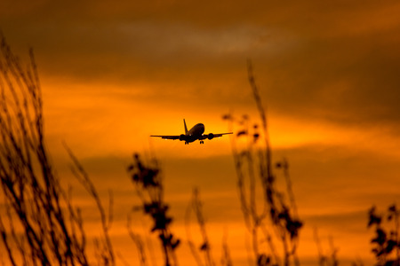 Silhouette of a aircraft approaching the airport.