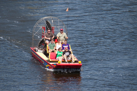 JACKSONVILLE, FLORIDA, USA - MARCH 17, 2013: A group of tourist starting an airboat ride in the St....
