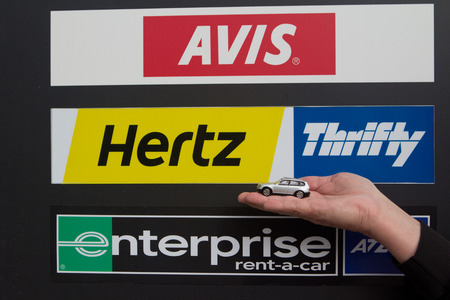 VALENCIA, SPAIN - JANUARY 25, 2014: A rental car sign at the Valencia airport.  The rental car industry is a 31 billion dollar industry worldwide with Hertz having 28% of the market share. のeditorial素材