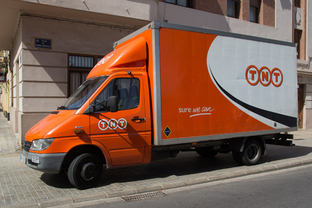 VALENCIA, SPAIN - JUNE 10, 2014:  A TNT Express truck in Valencia.  TNT Express is an international courier delivery services company with sales of over â¬6.69 billion in 2013.のeditorial素材