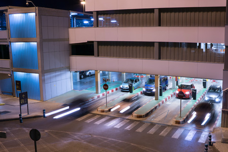VALENCIA, SPAIN - JUNE 25, 2014: Cars exiting the parking garage at the Valencia airport.  Situated 8 km from the city it is the 8th busiest Spanish airport with flight connections to 15 European countries.のeditorial素材