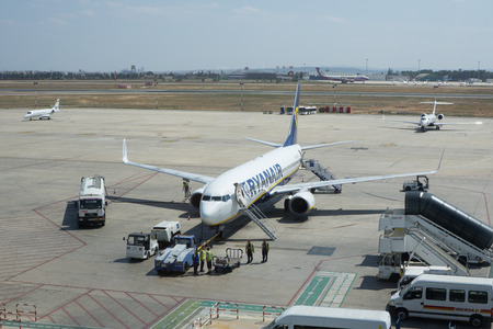 VALENCIA, SPAIN - AUGUST 2, 2014: A Ryanair aircraft getting ready for departure from the Valencia Airport. Ryanair is the biggest low-cost airline company in the world.のeditorial素材
