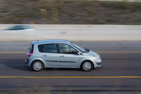 VALENCIA, SPAIN - NOVEMBER 7, 2014: A Renault Scenic auto on the highway in Valencia. The Scenic is a compact mult-purpose vehicle (MPV) produced by French automaker Renault.のeditorial素材