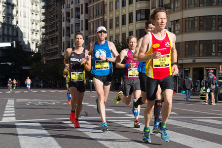 VALENCIA, SPAIN - November 16, 2014: Runners compete in the 2014 Valencia Marathon in Valencia, Spain.のeditorial素材