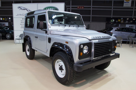 VALENCIA, SPAIN - DECEMBER 4, 2014:  A silver 2013 Land Rover Defener at the Valencia Automovil 2014 Car Show. Production of the Defender model began in 1983.のeditorial素材