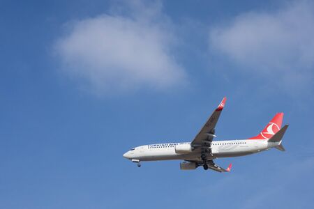 VALENCIA, SPAIN - JANUARY 6, 2015: A Turkish Airlines Boeing 737-800 landing at the Valencia Airport. Turkish Airlines is the national flag carrier airline of Turkey with services to 41 domestic and 206 international airports.のeditorial素材