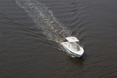 JACKSONVILLE, FLORIDA, USA-JULY19, 2015: A white fishing boat in the Intracoastal Waterway of Jacksonville. In 2014, Florida had 899,635 registered boats; the most than any other state in the US.のeditorial素材
