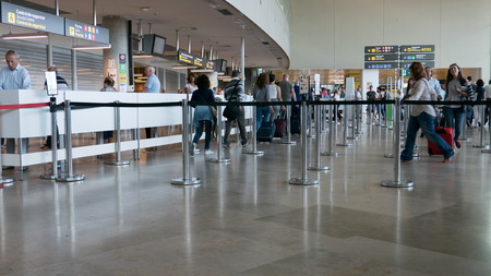 VALENCIA, SPAIN - SEPTEMBER 24, 2015: Airline passengers going through the security line in the...
