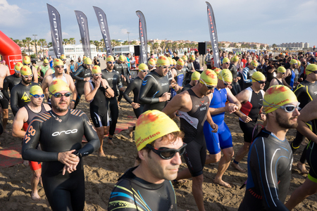 VALENCIA, SPAIN - JUNE 4, 2016: Triathletes start the 1500 meter swim portion of the Santander Maritim Triathlon. The swim is followed by a 40 kilometer bike ride and then a 10 kilometer run.のeditorial素材