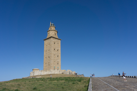 LA CORUNA, SPAIN - AUGUST 20, 2016: The Tower of Hercules with blue sky. The tower is the oldest Roman lighthouse in use today and overlooks the Atlantic coast of Spain from A Coruna.のeditorial素材