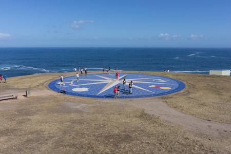 LA CORUNA, SPAIN - AUGUST 20, 2016: Tourist at the Compass Rose (La Rosa de los Vientos) at the Tower of Hercules in La Coruna, Spain.のeditorial素材