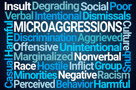 Microaggressions Word Cloud on Blue Backgroundの写真素材