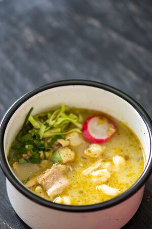 Pozole verde, or green posole is traditionally made with hominy and meat and topped with condiments. Mexican cuisine.の写真素材