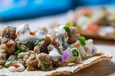 Vegetarian vegan ceviche on toasted tortillas. Mexican ceviche made of texturized vegetable protein with lime juice, jalapeno, onion and cilantro. Healthy vegetarian cuisine.の写真素材