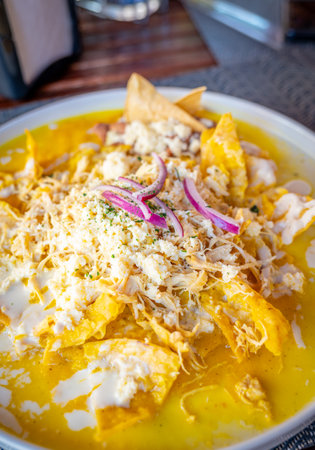 A Delicious Plate of Chilaquiles Amarillos on a Tableの写真素材