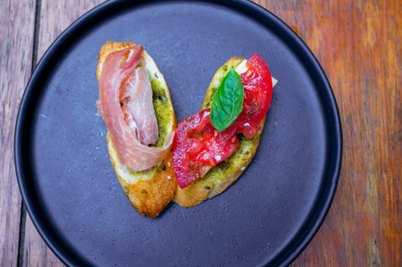 Bruschetta Anti Pasti. Italian Food on Black Plateの写真素材
