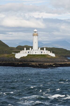 Lighthouse of Scotland seen from a boatの写真素材