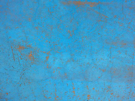 Image of weathered blue wall with peeling paint の写真素材