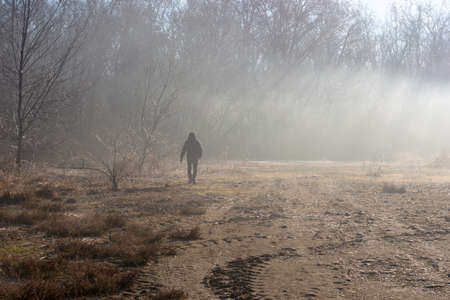 Man walking in the fogの写真素材