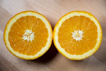 Orange over a wooden surfaceの写真素材