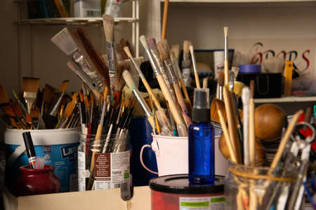 London - United Kingdom - December 23 2019 - Paintbrushes and other tools in an art studio.のeditorial素材