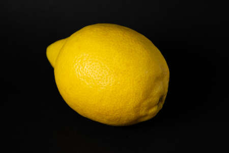 A juicy lemon on a black backgroundの写真素材