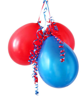 Red and blue balloons with curly ribbons, on white background.の写真素材