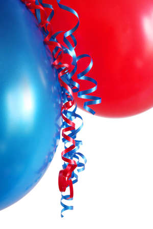 Red and blue balloons, with curly ribbon.の写真素材