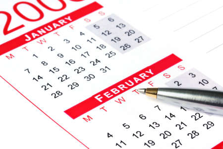 Pen on calendar, ready to make notes or make appointments.の写真素材