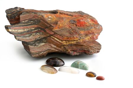 A piece of Tiger Iron with bands of Tiger Eye, from Western Australia, with a collection of polished...