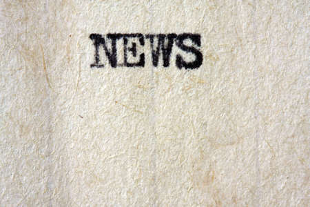 The word "News" typed using a vintage typewriter, on aged paper.  Great paper texture in this macro view.  Lots of copyspace.の写真素材