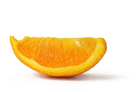 Wedge of an orange, casting soft shadow on white.  