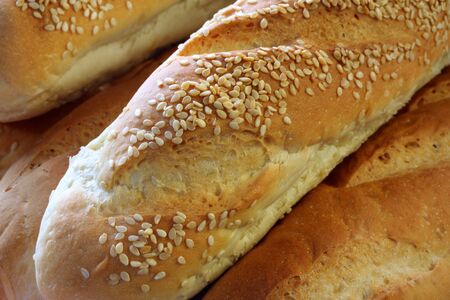 Bread sticks with sesame seeds.  Full-frame close-up.