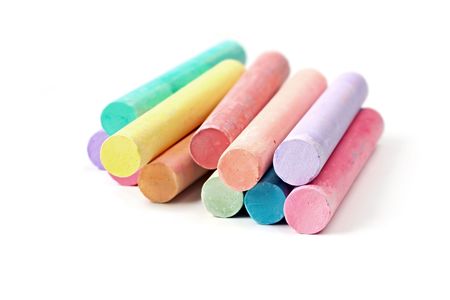 Sticks of pastel colored chalk, isolated on white with natural shadow.の写真素材