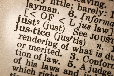 Dictionary definition of "justice".  Close-up view, with good paper textures.の写真素材