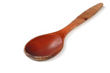 Old wooden spoon, isolated on white with natural shadow.  の写真素材