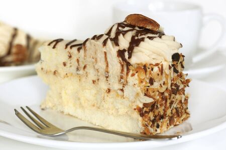 Pecan cream sponge cake, with a cup of coffee.