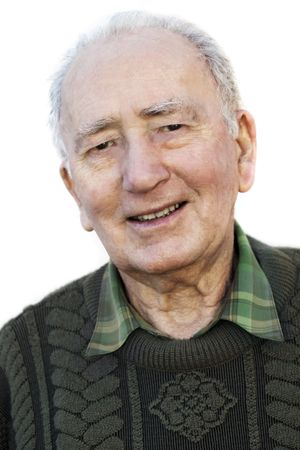 Portrait of a smiling senior man, over white background.  A fit, healthy retiree in his 80s.