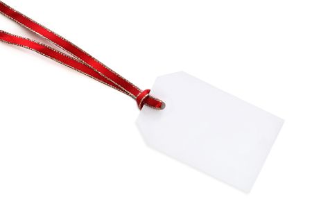 Blank white gift tag with red and gold ribbon.  Isolated on white with soft shadow.の写真素材