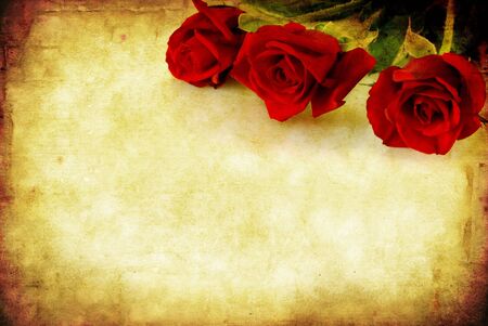Valentine's Day background, combining red roses with sandstone and paper grunge textures.の写真素材