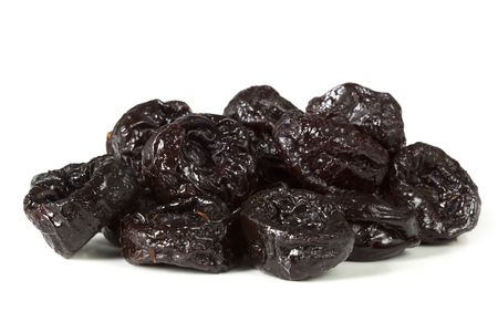 Sweet pitted prunes, isolated on white with soft shadow.の写真素材