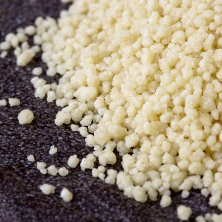 Close-up of cous cous, over stone background.の写真素材