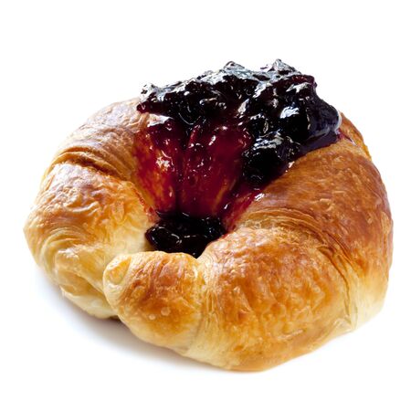Croissant smothered in sweet black currant jam.  Isolated on white.の写真素材