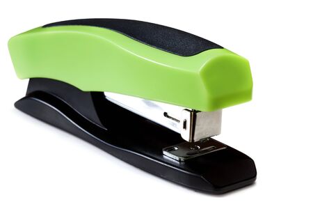 Green and black stapler, isolated on white with soft shadow.の写真素材