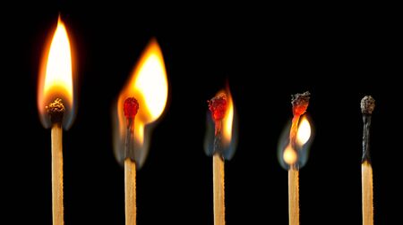 Sequence of burning match images, from full flame to extinguished.の写真素材